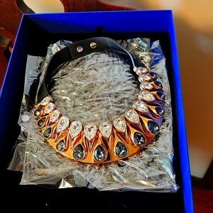 Swarovski Signed collar necklace with leather snap closure.